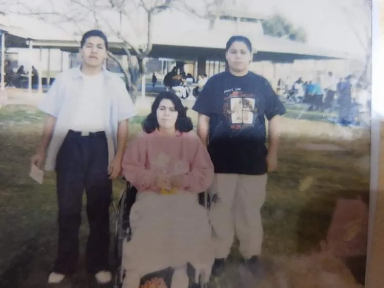 Gerardo (left) is vited at YTS by his mother, in a wheelchair from a recent car accident, and brother in 1995.