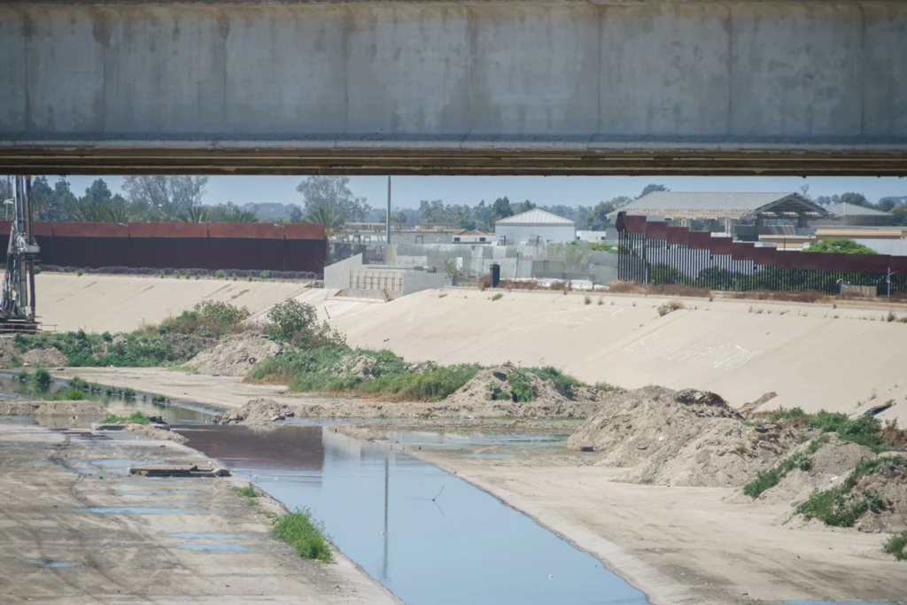 Gerardo crossed back into Mexico here in 2014, near the Tijuana River Canal, where deportees are commonly released back into Mexico. Many choose to live in the canal without anywhere else to go. (Photo by David Reeve, 2023)
