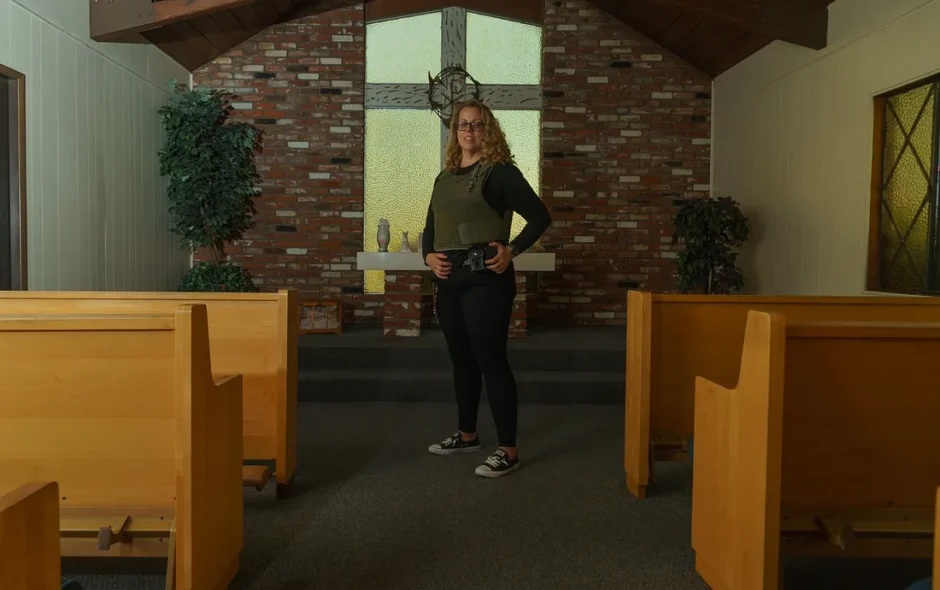 Dr. Ashley Massimino is photographed demonstrating her prison attire inside the Rose of Sharon Prayer Chapel at Biola University in 2024. (Photo by David William Reeve)