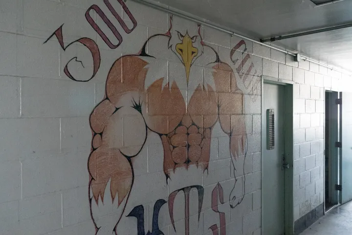 A wall in the gymnasium painted to honor the 300 club, wards who could bench press 300 lbs. (Photographed by David Reeve)
