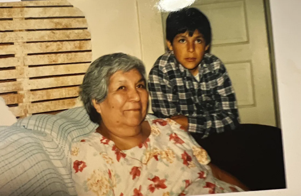 A young Adam Mortera and his grandmother in 1984