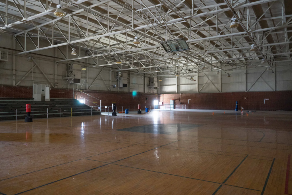 To accomodate more seating, the boxing ring was moved to the original YTS basketball gym for the big fight in 1987. (Photo by David William Reeve)