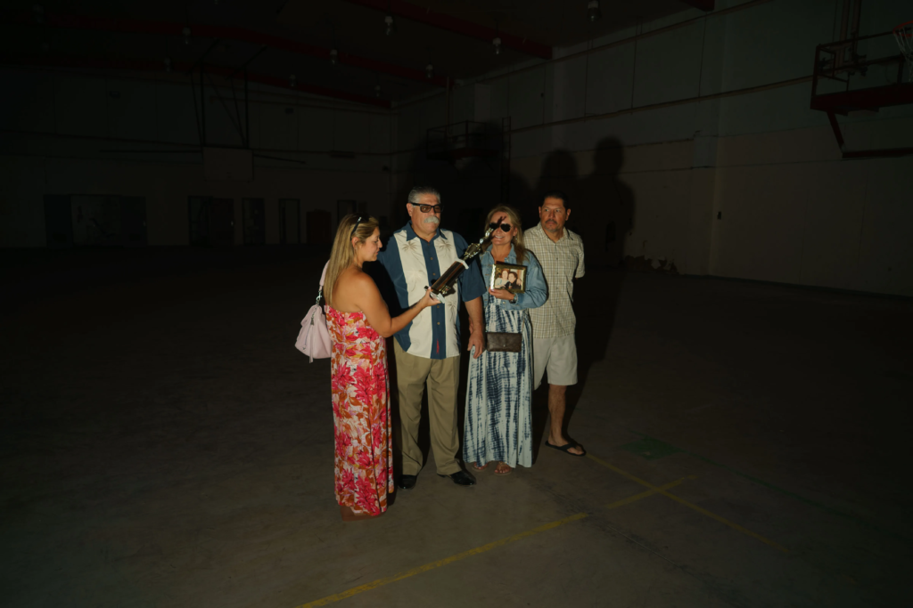 Tony Espinosa and his family, who attended the original fight, returned with him to collect the boxing trophy in 2024 at YTS. Here they are photographed by David William Reeve in the boxing gym.
