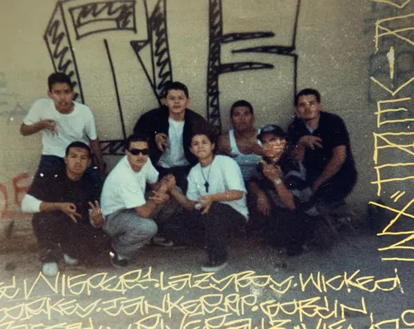 Jaime “Lazy” Morales is pictured above wearing a black cross necklace in Pico Rivera.